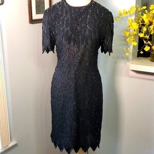 Black beaded vintage dress is Vintage.  Short scalloped‎ sleeve, hem Wimsigoth